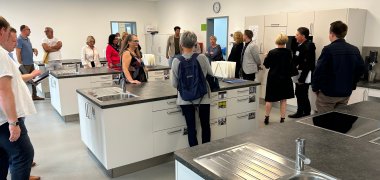 Committee members in the training kitchen