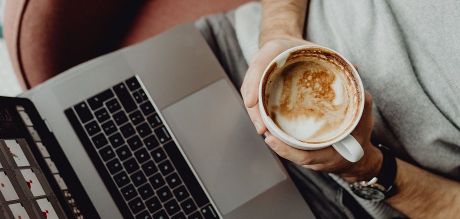 Coffee cup on the laptop