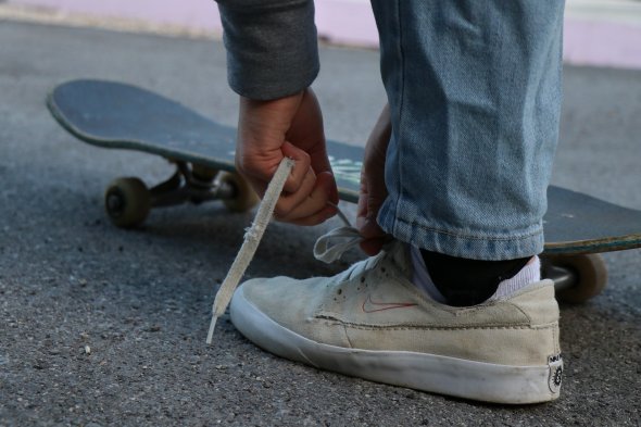 Skater laces up his skates