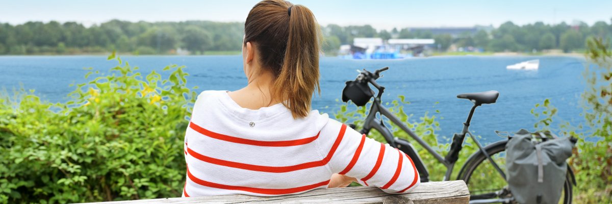 Woman on a bench by the lake