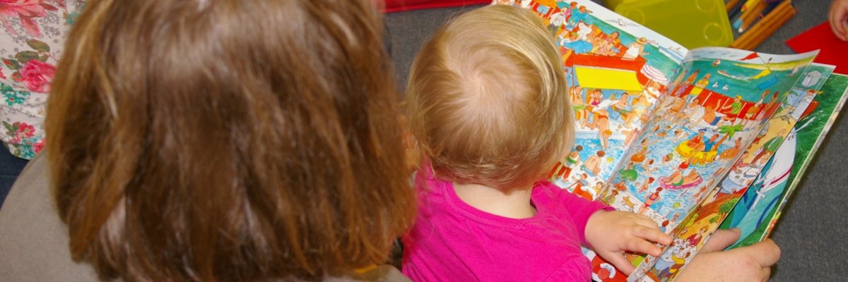 A book is read to a child