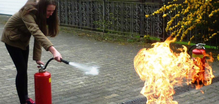 Girl puts out fire