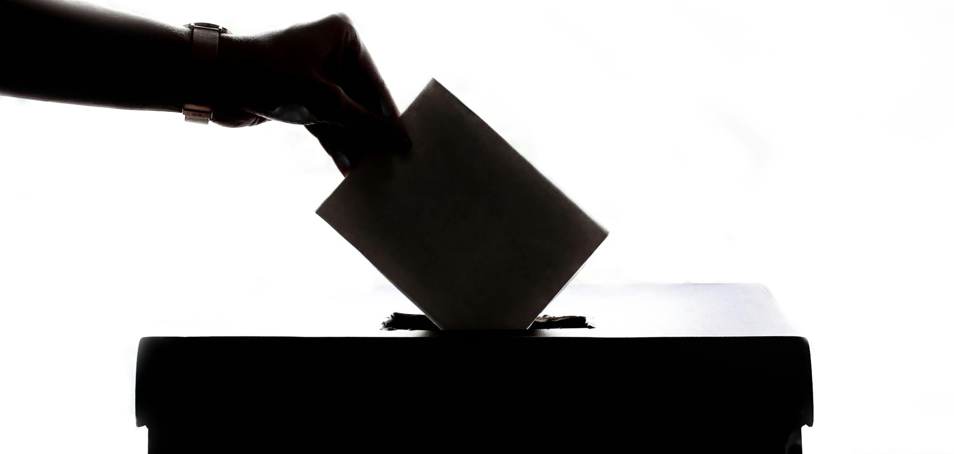 Hand on the ballot box