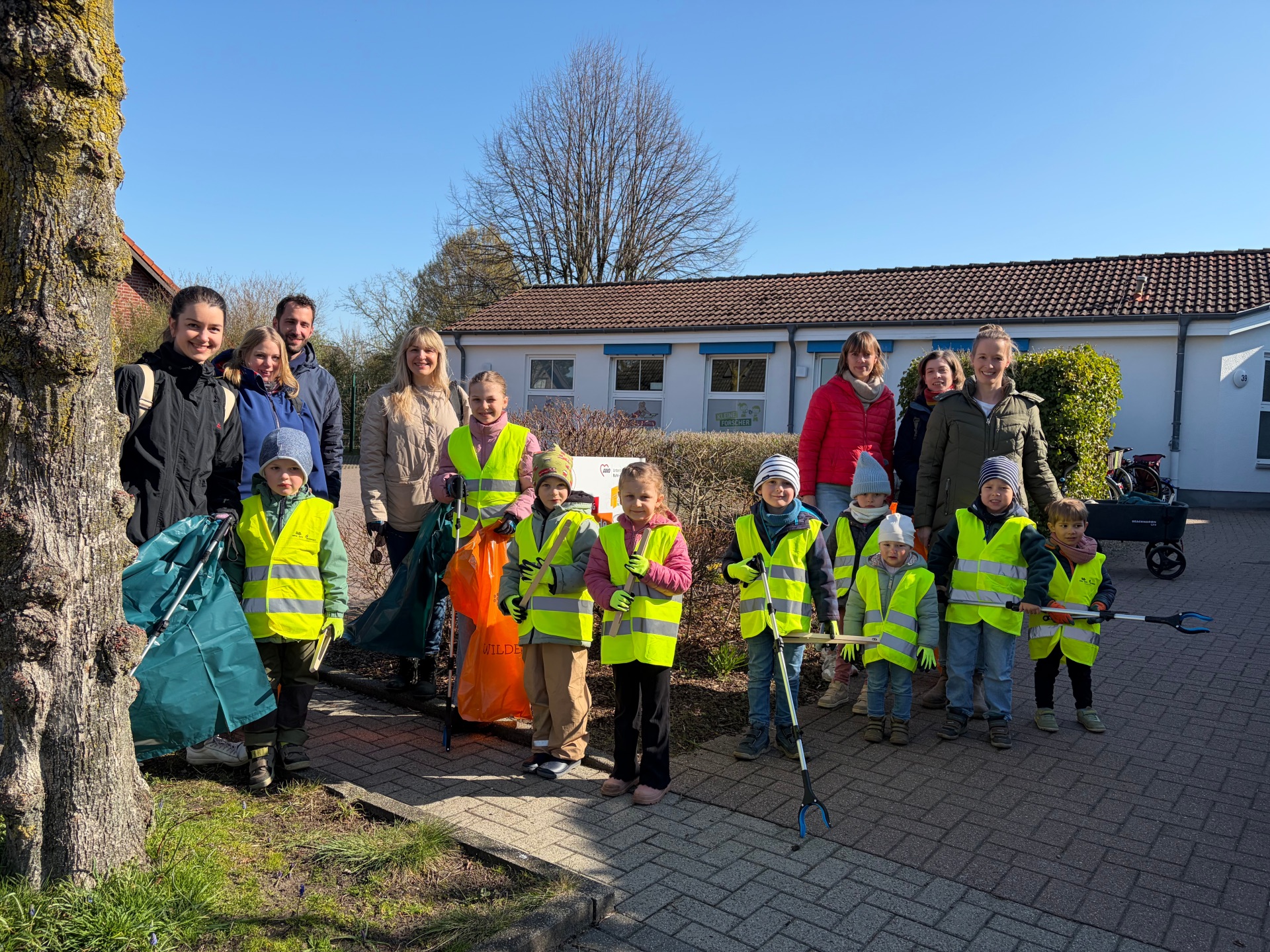 Daycare centre children collect rubbish