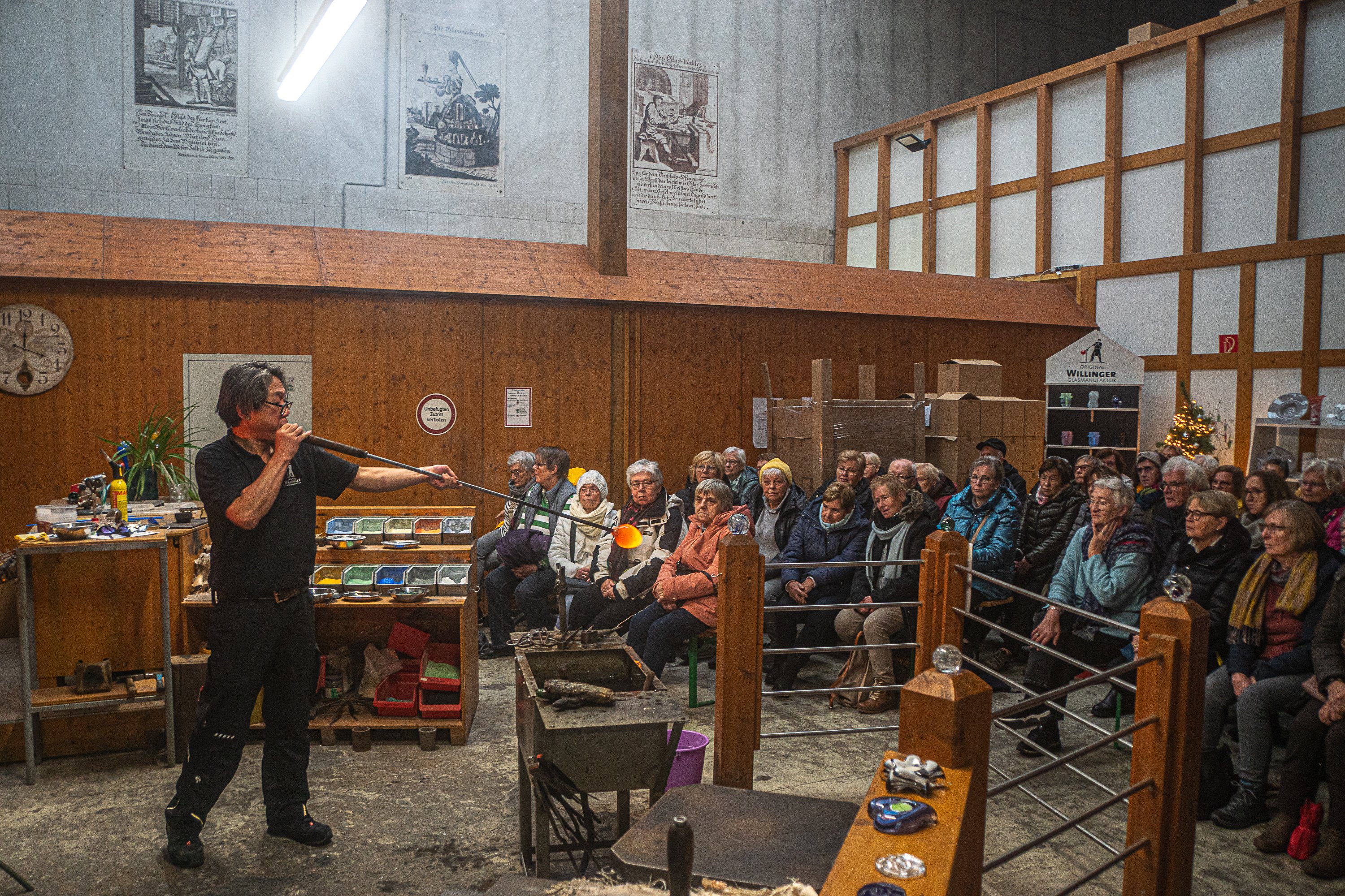 Glassblowers in the foreground