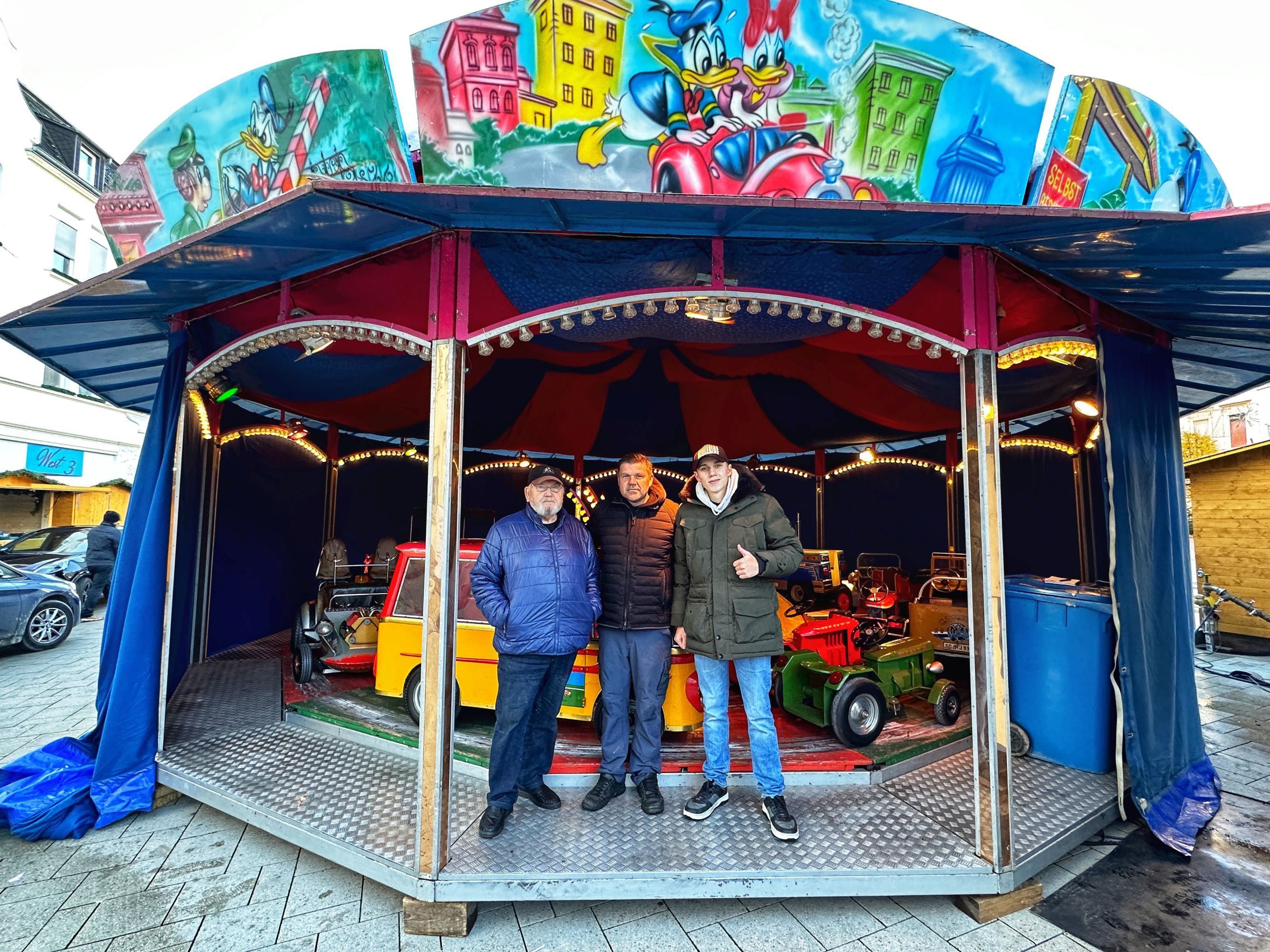 Showman family Anton in front of the children's carousel