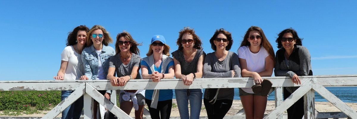 Women on a bridge on the beach